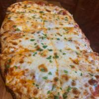 Traditional Cheese Flatbread Pizza · Shredded mozzarella cheese and tomato sauce.