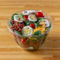 Americana Spinach Salad · Fresh baby spinach with tomatoes, mushroom, hard boiled egg, bacon, cheddar cheese and crout...