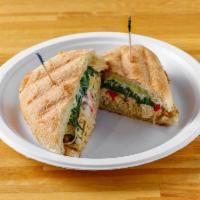 Chicken Pesto Melt · Chicken breast topped with pesto, melted mozzarella, spinach and roasted peppers. Served war...