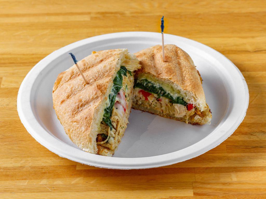 Chicken Pesto Melt · Chicken breast topped with pesto, melted mozzarella, spinach and roasted peppers. Served warm on ciabatta bread.