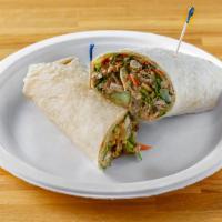 Zesty Asian Chicken Wrap · Pulled chicken breast, carrots, cucumbers, lettuce, crunchy chinese noodles and sesame ginge...