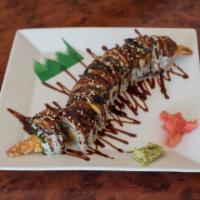 38. Black Dragon Roll · Tempura shrimp and topped with eel avocado.