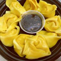 12b. Steamed Wonthon · Cooked using moist heat. Seasend broth with filled wonton dumplings.