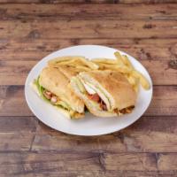 Grilled Chicken Sandwich · Chicken breast topped with melted Swiss, bacon, avocado, lettuce and jalapeno tartar sauce o...