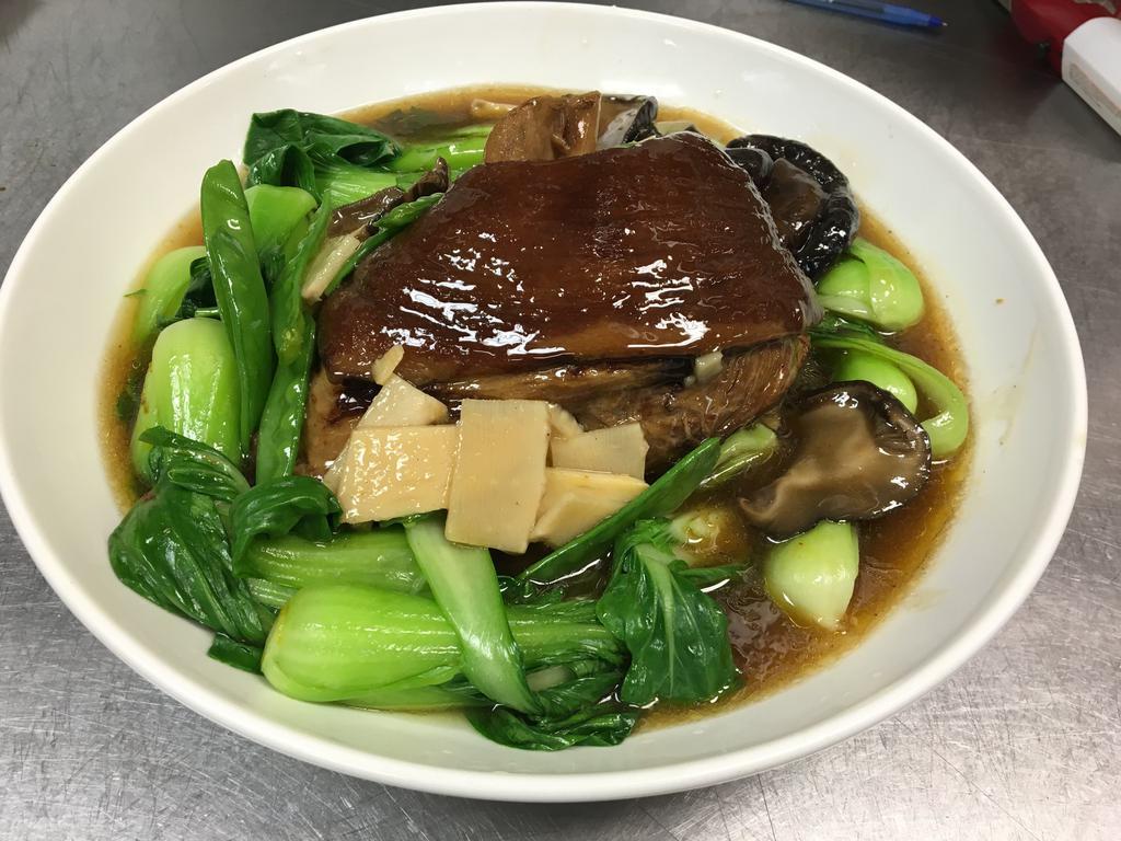 F11. Stewed Pork Shoulder 东坡肘子 · Served with bok choy, mushroom and bamboo shoot.