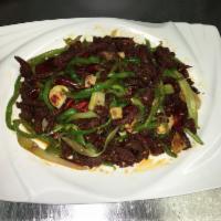 F16. Dry Sauteed Shredded Beef 干煸牛肉丝 · Spicy.