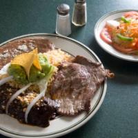 Tampiquena · Grilled steak with one chicken enchilada. Served with rice and beans 