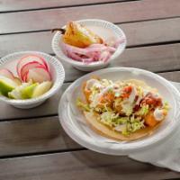 Fish Taco · Our specialty taco served with cabbage, pico de gallo, crema, salsa.
