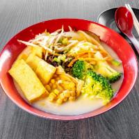 Vegetables Miso Ramen · Ramen noodle cooked in a vegetable miso broth. Served with seasoned egg, sprouts, green onio...