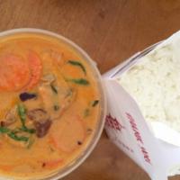 C6. Roasted Duck Curry · Spicy red curry with boneless duck, bell pepper, bamboo shoots, basil, onion and carrots. Sp...