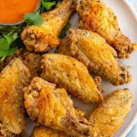 11. Chinken Wing(4) · Cooked wing of a chicken coated in sauce or seasoning.