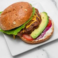 Black bean burger  · Topped with lettuce, tomatoes, avocado, onions, diya cheese, ketchup, and vegan mayo