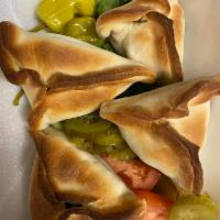 Spinach Pies Appetizer 4pc · Spinach, onions, lemon juice and seasonings baked in dough.