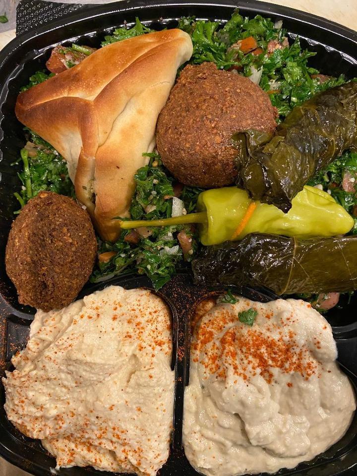 Starter Combination 2 · Combination of hummus, baba ghanoush, tabbouleh, grape leaves, falafel and spinach pie.