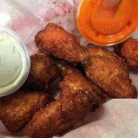 Order of Hot Wings · Crispy fried to order and served with a side of buffalo sauce and ranch or bleu cheese. 8 wi...