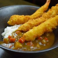 Curry Shrimp Katsu · Japanese breaded and fried shrimp over rice with curry sauce.