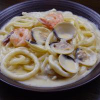 Seafood Creamy Udon · Creamy sauce, shrimp, squid, and onion.