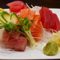 Sashimi Sampler Small Plate · Chef's choice of 9 pieces assorted sashimi.