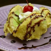Tempura Fried Ice Cream · Green tea ice cream tempura topped with chocolate sauce.