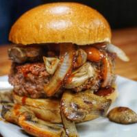 Truffle BBQ Burger · Smothered with truffle smoked hickory BBQ sauce, grilled onions and sauteed mushrooms and on...