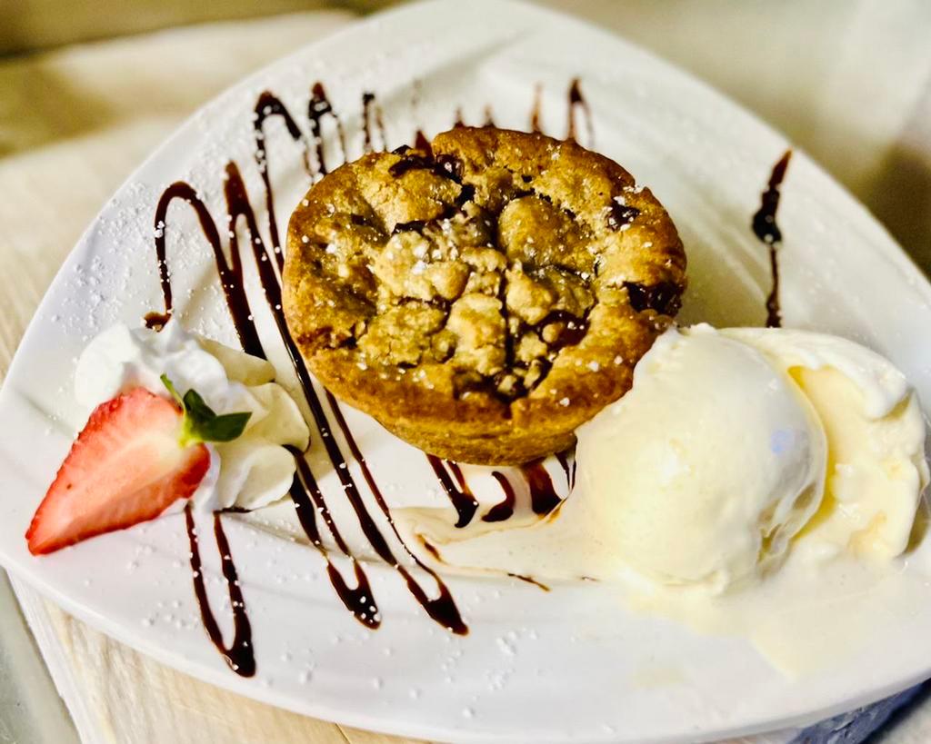 Cookie Lava · Served warm with whipped cream and a scoop of vanilla ice cream.