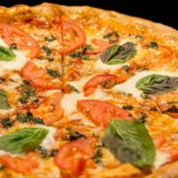 Margherita Pizza · Marinara, mozzarella, fresh tomatoes, fresh mozzarella and basil.