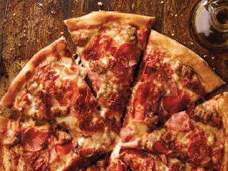 All Meat Pizza · Classic pepperoni, ham, Italian sausage, bacon, our signature sauce
and three-cheese blend.
