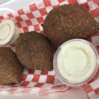 3 Pieces Kibbeh Frito · Selected seasoned fine meat ground with wheat stuffed with sauteed onions and ground beef.