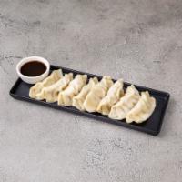 7. Steamed Dumplings · 8 pieces. Stuffed dough.