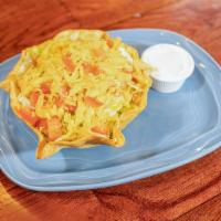 Classic Taco Salad · Choice of shredded chicken or ground beef served in a taco shell with onions, radish, tomato...