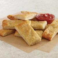 Bread Sticks · A medium sized buttered bread with a side of marinara sauce