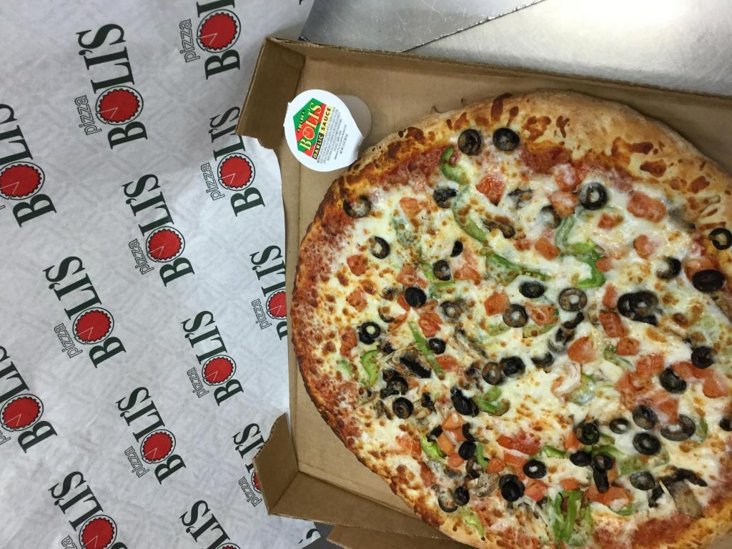 The Vegilicious Pizza · Our secret recipe pizza sauce topped with fresh mushrooms, fresh green peppers, fresh tomatoes, fresh onions, black olives and topped with an extra amount of our special blend of 100% fresh natural cheeses.