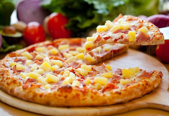 Hawaiian Pizza · Secret recipe pizza sauce topped with ham, pineapple, chunks and topped with special blend 100% fresh natural cheese.
