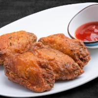 Fried Chicken Wings · 4 pieces. Battered chicken wings lightly seasoned with our special garlic sauce.