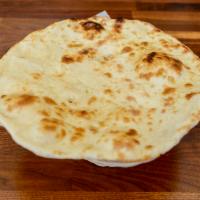 Butter Naan · Baked in a clay oven, topped with butter.
