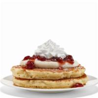 NEW! Cranberry Vanilla Pancakes (Short Stack) · Two fluffy buttermilk pancakes topped with creamy vanilla bean mousse, cranberry topping, wh...