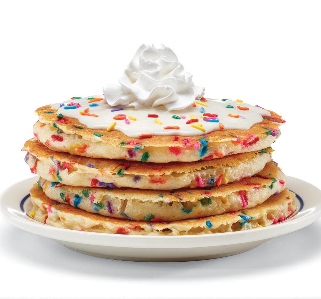Cupcake Pancakes · Celebrate breakfast! Four fluffy buttermilk pancakes filled with festive rainbow sprinkles. Topped with cupcake icing & crowned with  whipped icing. 