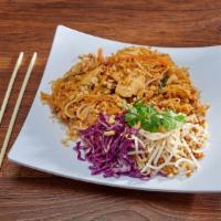 18. Pad Thai · Stir fried small rice noodles, shrimps, dry shrimps, egg, ground peanuts, tofu and bean spro...