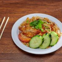 43. Kao Pad Gal Tod · Deep fried boneless chicken breast over fried rice with egg, white onion, tomatoes, topped w...