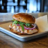 Grilled Salmon Sandwich · Citrus honey glazed grilled salmon on a toasted bun with arugula, sliced tomato, red onions,...