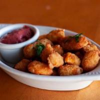 Jalapeño Cheese Curds · Jalapeño cheese curds served with a sweet berry sauce.