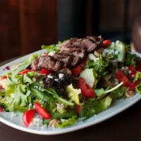 Shamrock Steak Salad · Mixed greens tossed in balsamic dressing: topped with grilled sliced steak prepared medium, ...