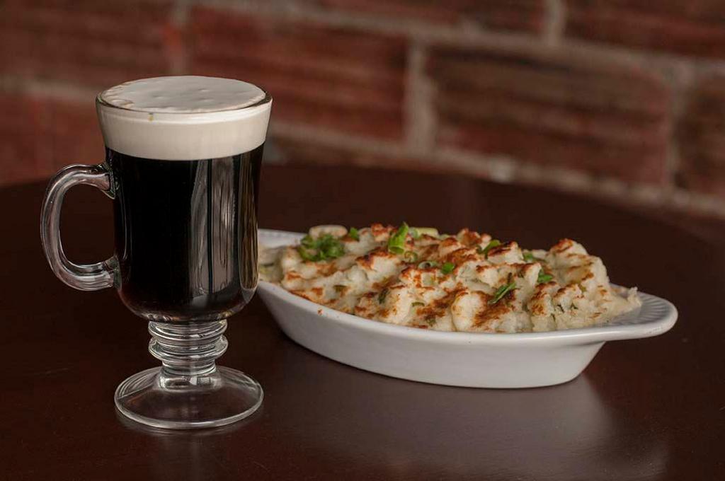 Shepherd's Pie · Ground beef slow cooked with peas, carrots, mushrooms, and onions, in brown gravy topped with toasted mashed potatoes.