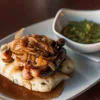 Bangers and Mash · Four Irish bangers served atop a hearty pile of champ mashed
potatoes, and topped with an o...