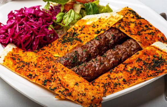 Special Adana · Hand chopped lamb with special bread and vegetables.