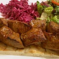 Shish Kebab · Marinated lamb cubes on skewer.