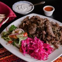 Gyro Kebab · Doner kebab. Ground lamb seasoned with herbs and spices wrapped around a vertical rotating s...