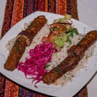 Bosphorus Kebab · Chopped lamb with garlic and spices; comes with grilled tomatoes, eggplant and onion salad.