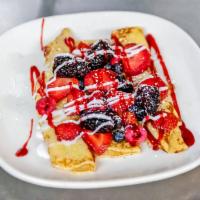 Very Berry Crepes · Fresh strawberries, blackberries, blueberries, and raspberries stuffed into crepes, topped w...
