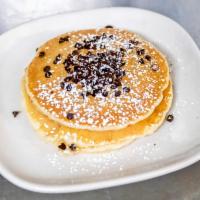 Buttermilk Pancakes · Scratch recipe buttermilk pancakes, light and fluffy, dusted with powdered sugar. Served wit...